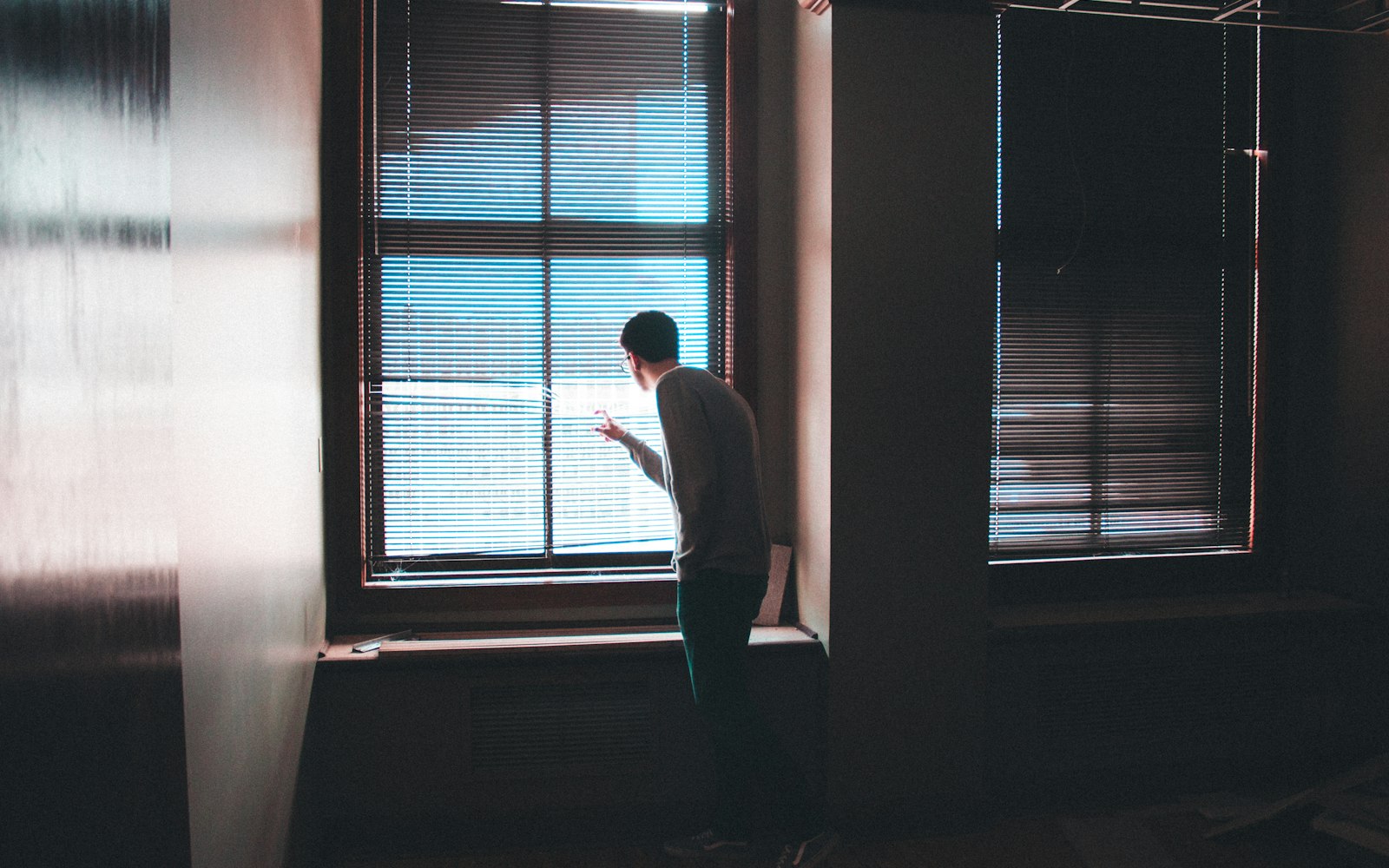 A person by an office window